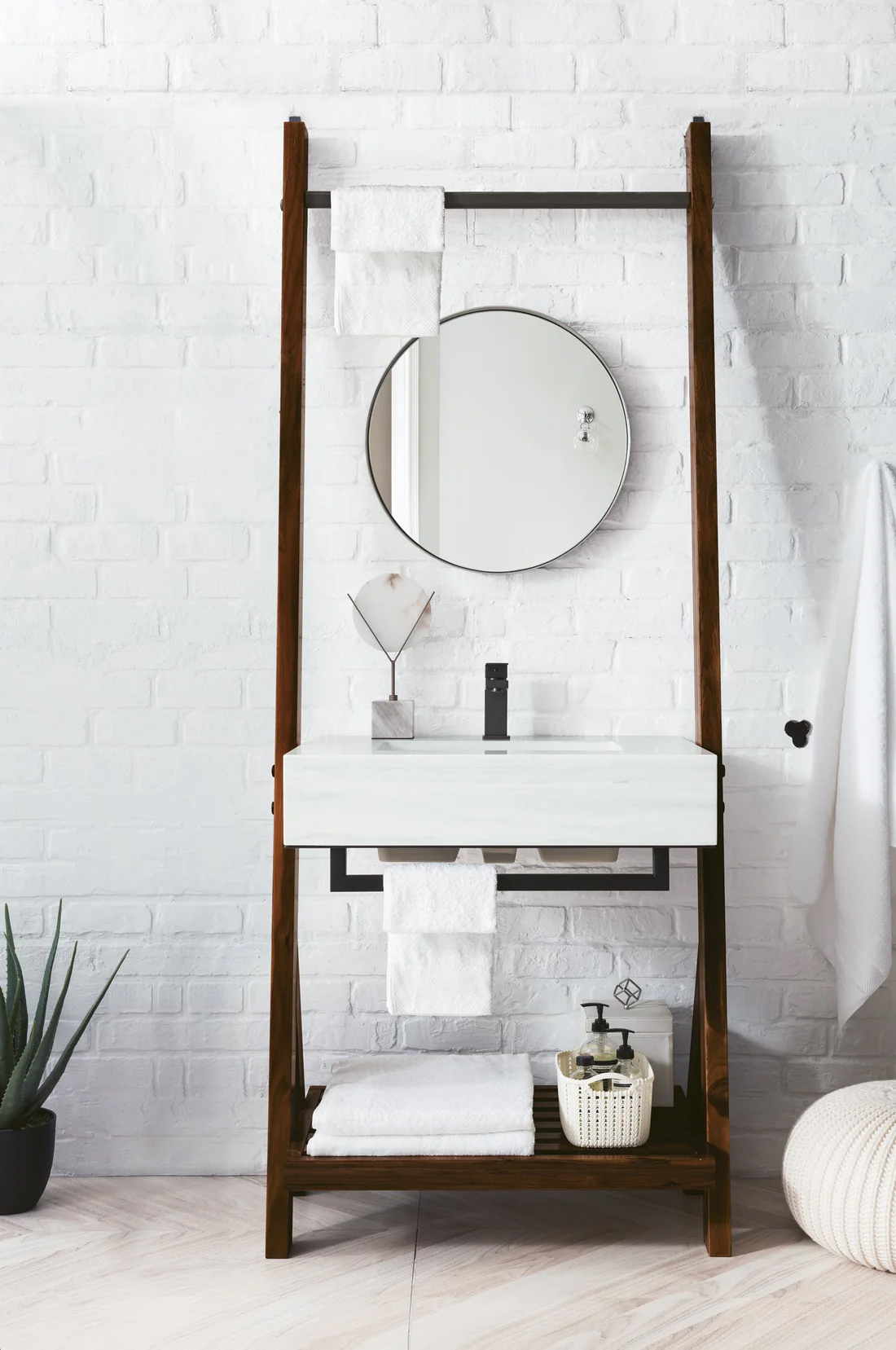 Modern sink vanity with round mirror and dark brown wood